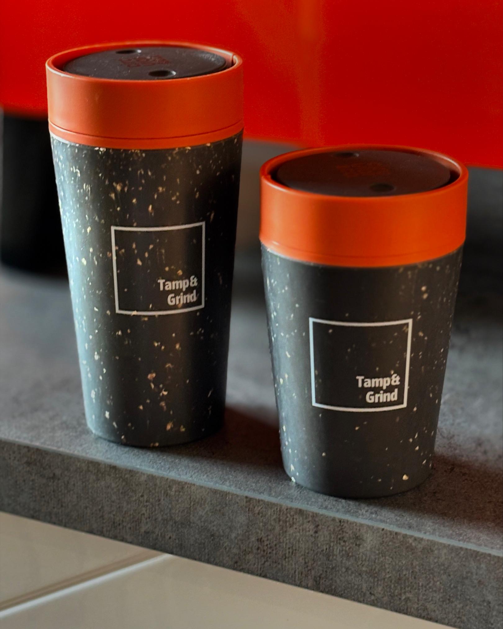 Tamp & Grind takeaway cups on counter
